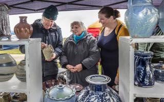 Fun - Peter Deans showing Kate and Emely Houghes his ceramics at the craft fayre