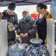 Fun - Peter Deans showing Kate and Emely Houghes his ceramics at the craft fayre