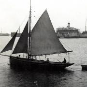 Tollesbury fishermen with SS London Merchant in the background