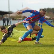Derby duel: Maldon and Tiptree's new man Michael Salako tussles with Coggeshall Town’s ex-Jammers player Evan Collard.