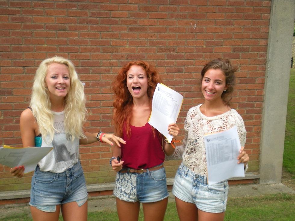 (L to R): Triplets Joy, Polly and Fleur Young with their A-level results.