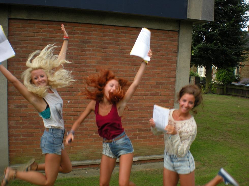 (L to R): Triplets Joy, Polly and Fleur Young with their A-level results.