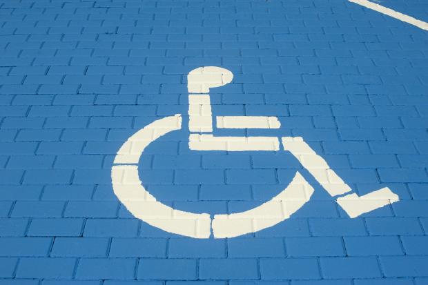 A disabled parking sign painted onto the floor