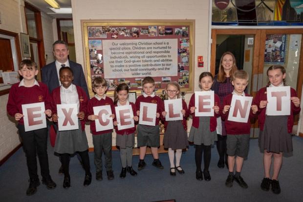 TOP CLASS: All Saints’ Primary pupils celebrating the school’s ‘excellent’ rating from inspectors
