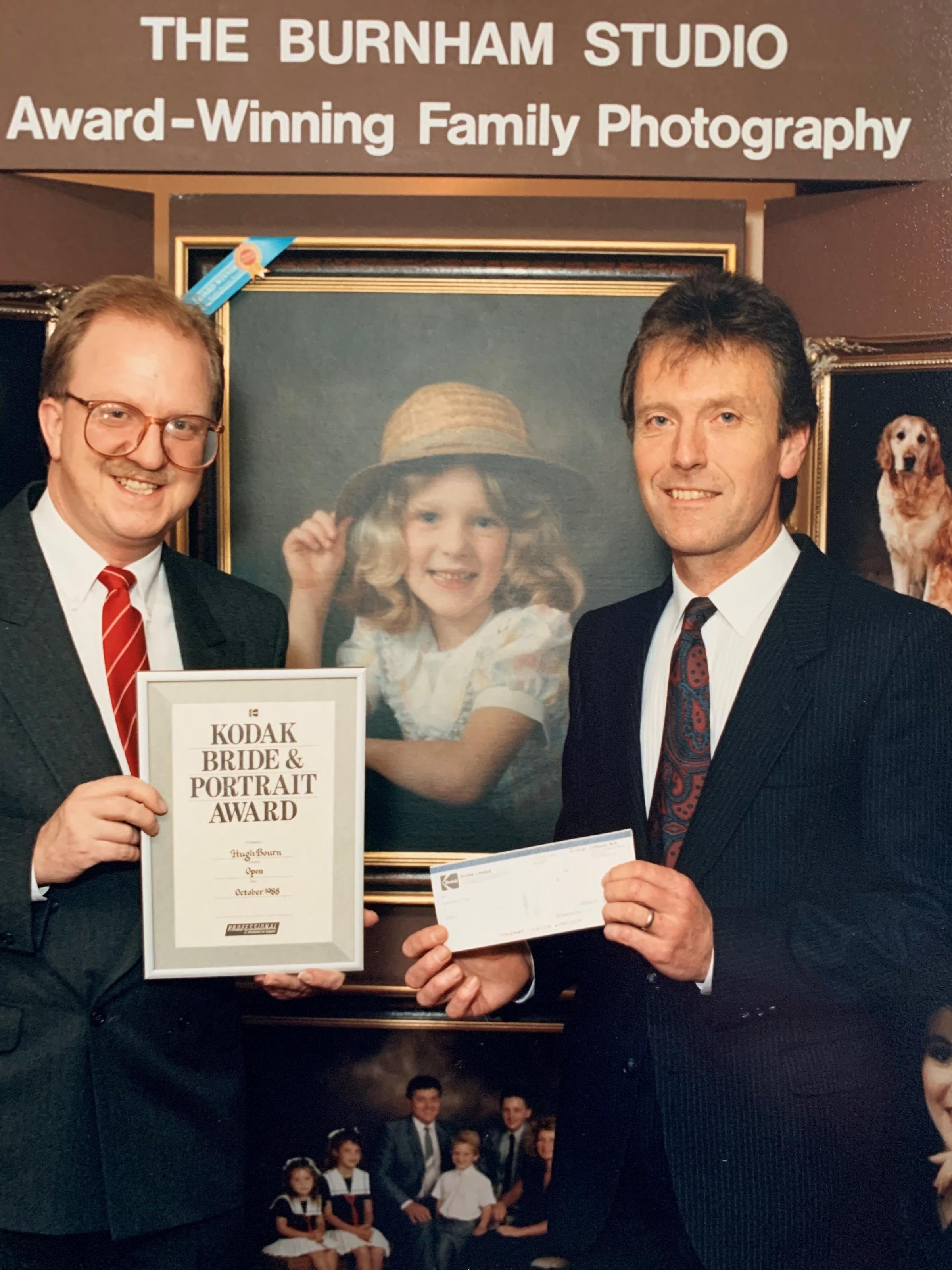 Hugh Bourn (right) being presented with an award by Gavin McCoy of Essex Radio