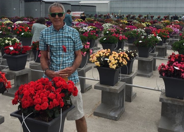 Alan Bourne admiring flowers at a competition