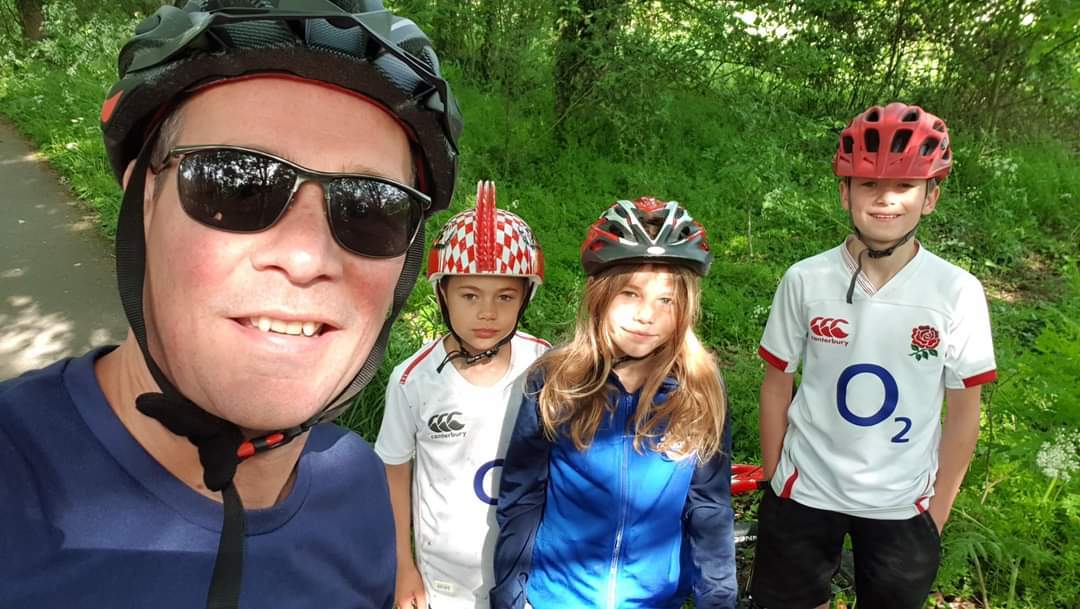 Selfie photo of my three children and myself on one of our lockdown Sunday morning bike rides