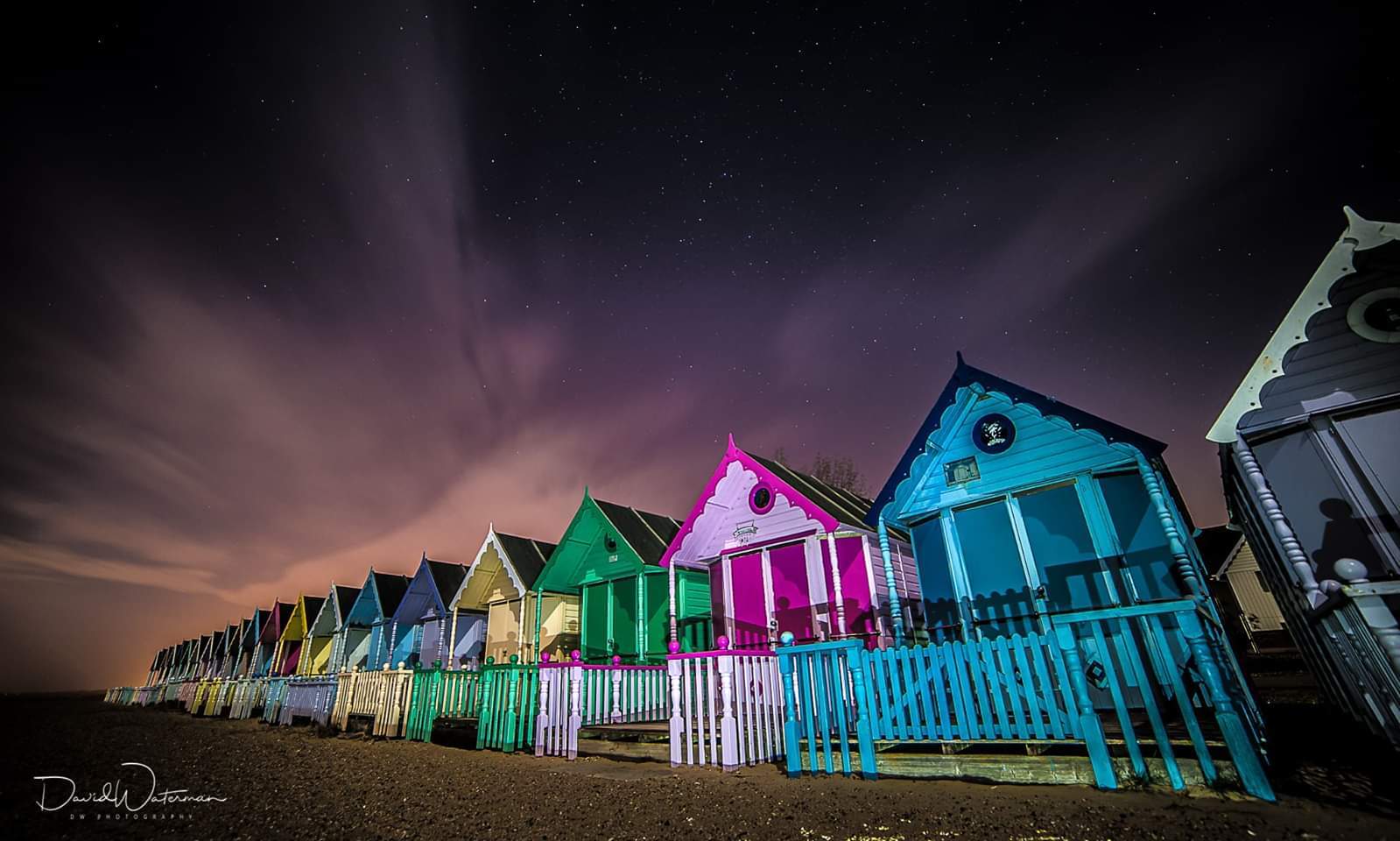 Photo of the Mersea island beach huts on a very cold night.