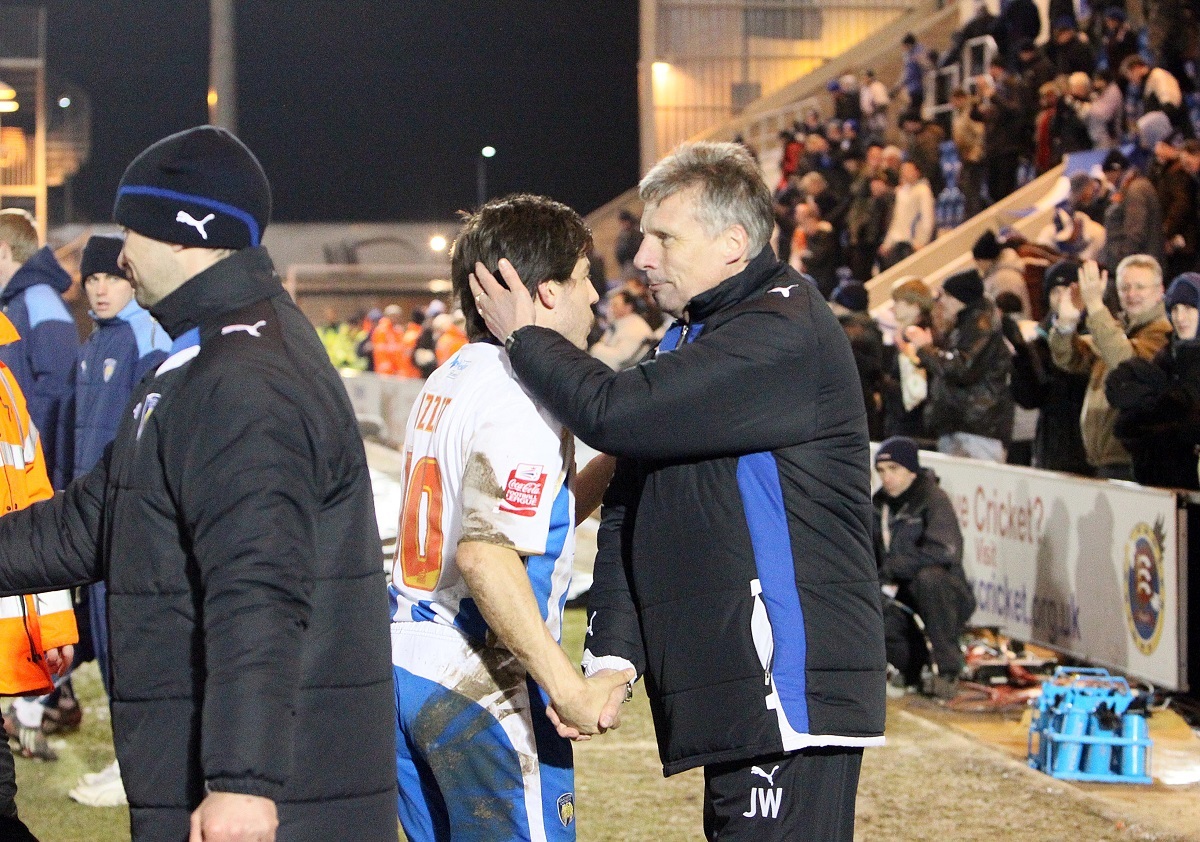 Well played, son - Us boss John Ward congratulates skipper Kem Izzet after their sides 2-0 victory in February 2010. Anthony Wordsworth scored both goals, netting after three minutes and then just after the hour-mark