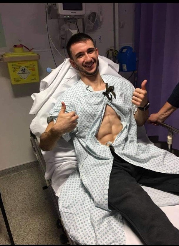 James Bailey in hospital in 2018. See SWNS story SWBRjudo; A martial arts champion who won gold at the European Championships has revealed his lifelong fight with epilepsy - and how he suffers up to 250 seizures per DAY. James Bailey from Essex, began