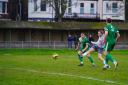Strike: Maldon and Tiptree's George Smith fires towards goal during his side's defeat at Gorleston.
