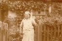 Edith Nunn standing at the garden gate to 51/73 Wantz Road