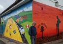 Artist Keith Hollingsworth with the new mural