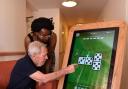 Activities organiser at the Bradwell care home, Louise Simon and resident Stanley enjoying one of the new tablets