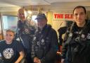 Caroline Community Radio presenter Josh Holmes-Bright with officers from the Essex Police Marine Unit in Studio 2
