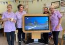 Knightswood Day Centre staff with its new 'Tiny' tablet
