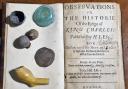 Civil War objects, including a clay pipe bowl, coin and musket balls