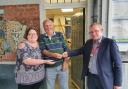 Maldon CVS director Sarah Troop and shed member Bob Adams accept the keys for the shed from Alan Whyld at Southminster station. Credit: Maldon & District CVS