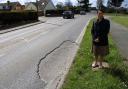 Priti Patel checks out the very large pothole in Maldon Road, near the junction with Station Road, Tiptree