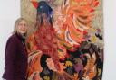 Sylvia Paul with her largest artwork - a wall hanging of a phoenix - set to be displayed in Maeldune Heritage Centre