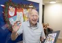 Cheer: a Elmcroft Care Home resident with some of the art
