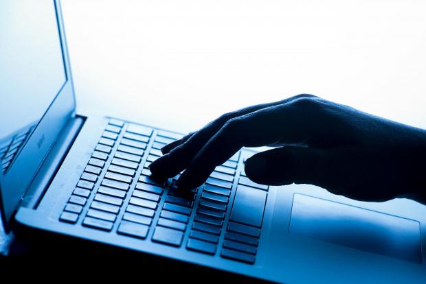 Maldon and Burnham Standard: A person typing on a laptop. Credit: PA