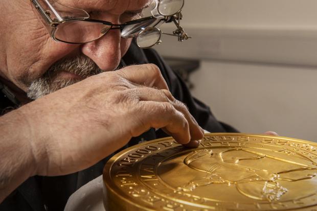 Maldon and Burnham Standard: Master craftsman Steve Dyer works on the 15 kilo gold coin by hand. Credit: The Royal Mint