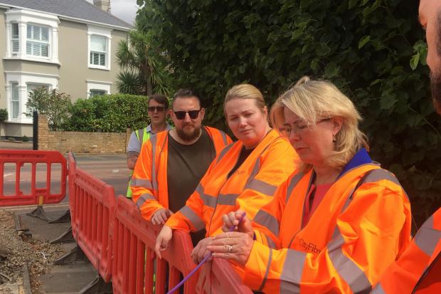 Members of the CityFibre team show Anna Firth, MP for Southend West, around the city build