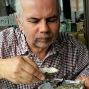 Stephen Nunn tucking into a plate of oysters