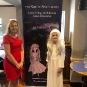 Sam Scott and guest reader Emily, dressed as main character Sophie Spirit, at the book launch