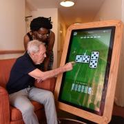 Activities organiser at the Bradwell care home, Louise Simon and resident Stanley enjoying one of the new tablets
