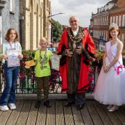 Winner of the competition, Emily Whitworth, with third place winner Charlie Taylor, town mayor David Ogg, and carnival princess Anya Downs