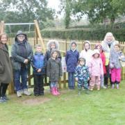 Councillors Jane Fleming, Penny Channer, and Joanna Symons (L to R) with children at the grand opening of the new playground in Woodham Walter