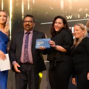 Kismet Kebabs bosses accepting the Supplier of the Year award on stage