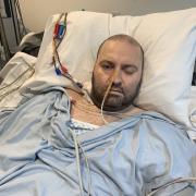 John O'Neill, 42, in hospital after a rare reaction to the AstraZeneca vaccine caused a life changing stroke