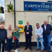 The Carpenters Arms, Maldon Masonic Hall and Maldon Court Preparatory School unveiled the pub's new defibrillator unit with council chairman Mark Heard