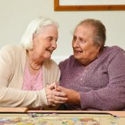 Lily and Edith enjoy doing puzzles together.