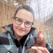 Volunteer award: Amy Hamilton cuddled up to hen with award