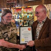Station Arms landlord Martin Park receives his award from CAMRA's James Burrell-Cook