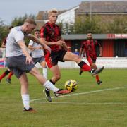 Derby duel: Maldon and Tiptree's George Smith in action against Brightlingsea Regent.