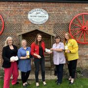 Donation: Jeanette Lynes, Aimee Meredith and Liz Baker with Cherry Rowlands and Angela Taylor from Marie Curie