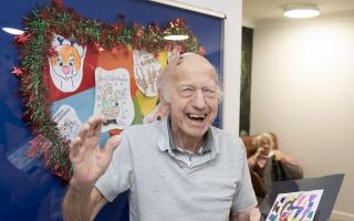 Cheer: a Elmcroft Care Home resident with some of the art