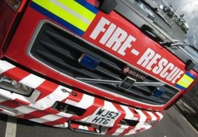 Two fire crews tackle digger blaze in Langford